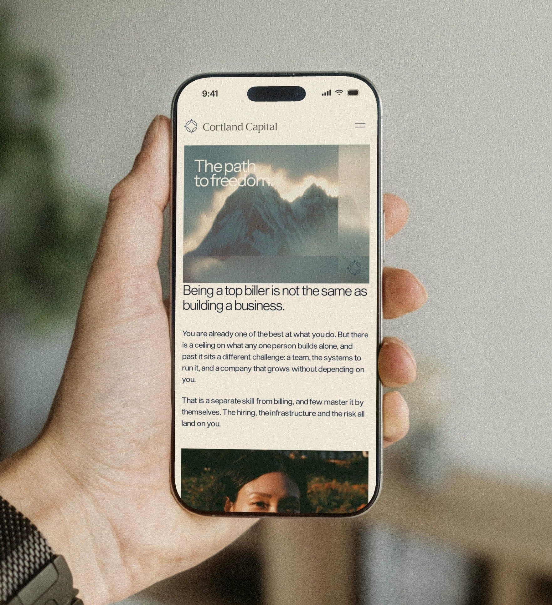 The Path to Freedom on an iPhone held in one hand