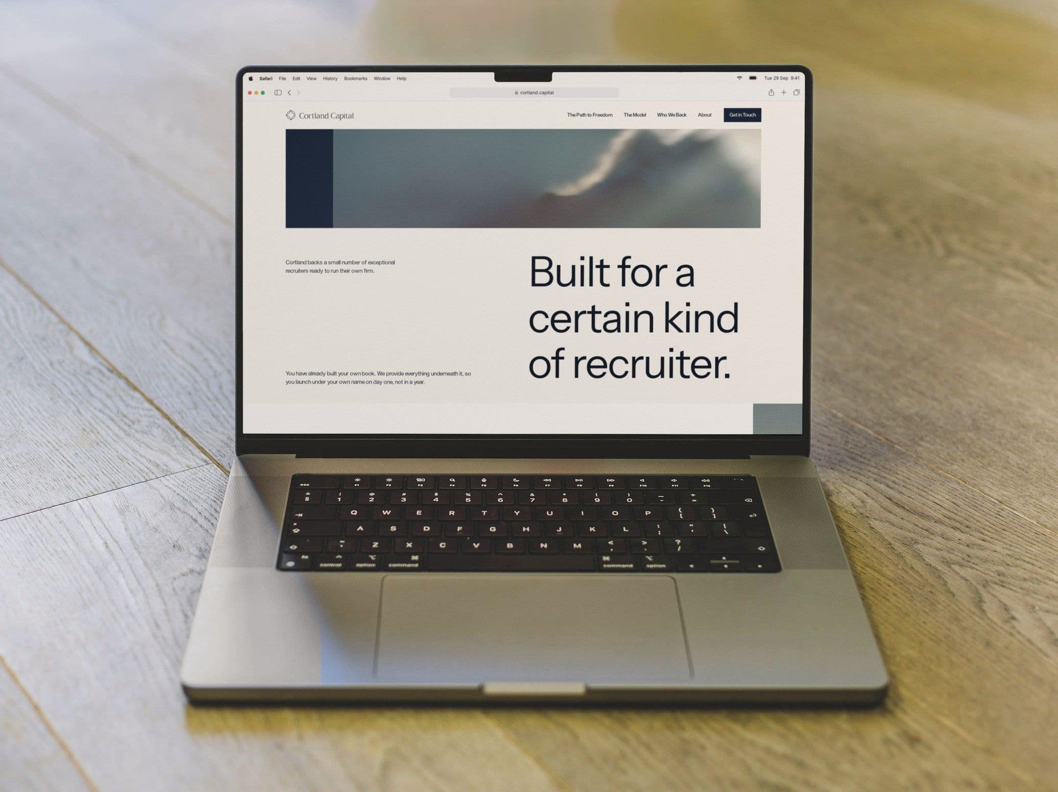 Who We Back, Built for a certain kind of recruiter, on a MacBook on a wooden floor